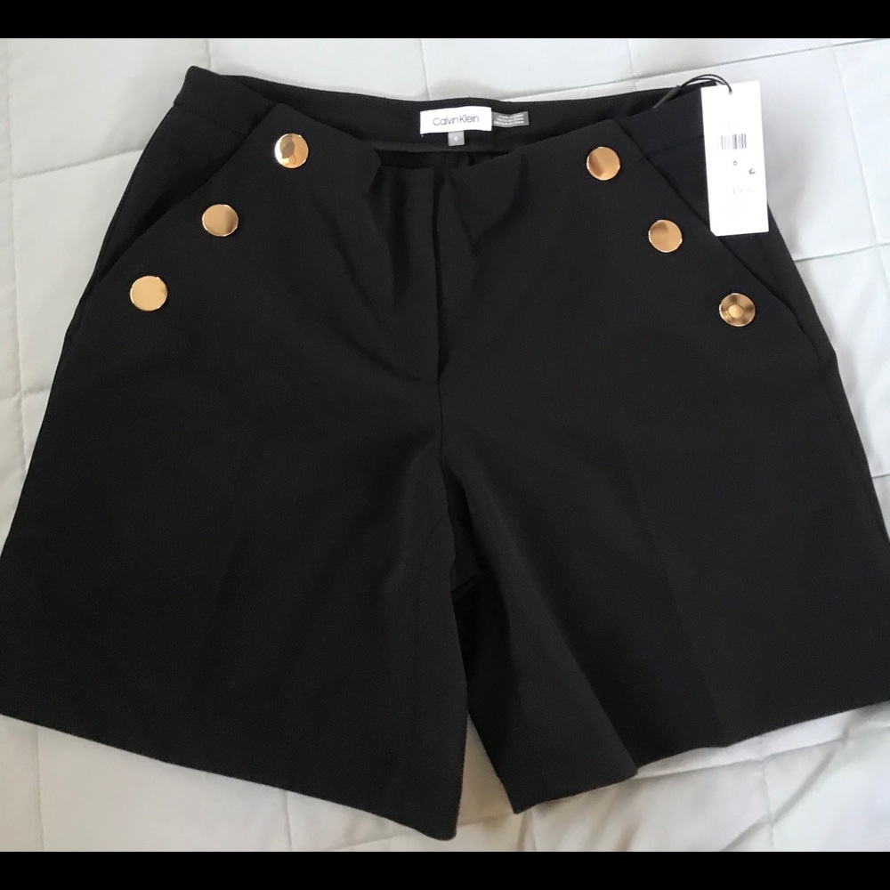 Calvin Klein black shorts with gold buttons